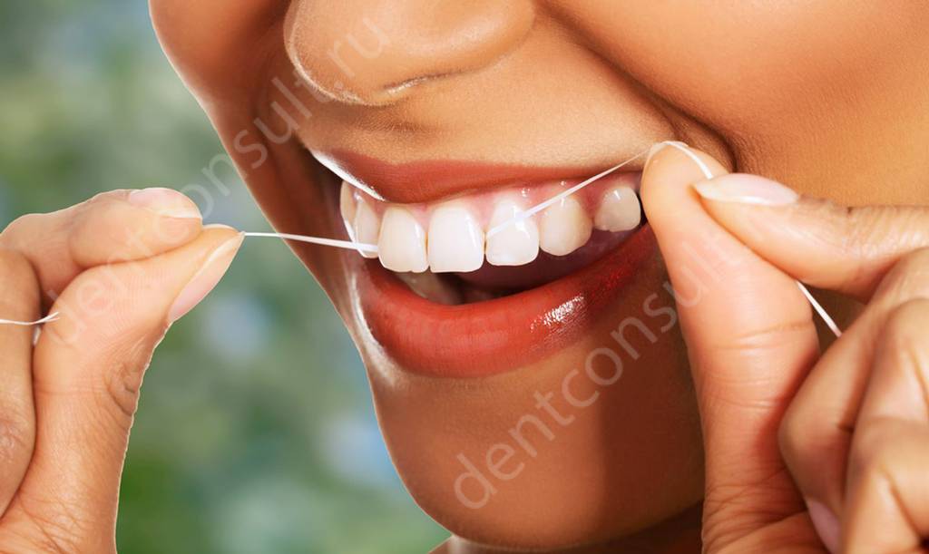 Пользование зубной нитью